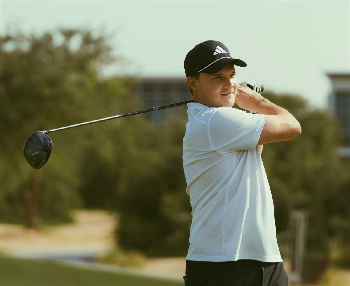 A member watching his shot from the follow-through