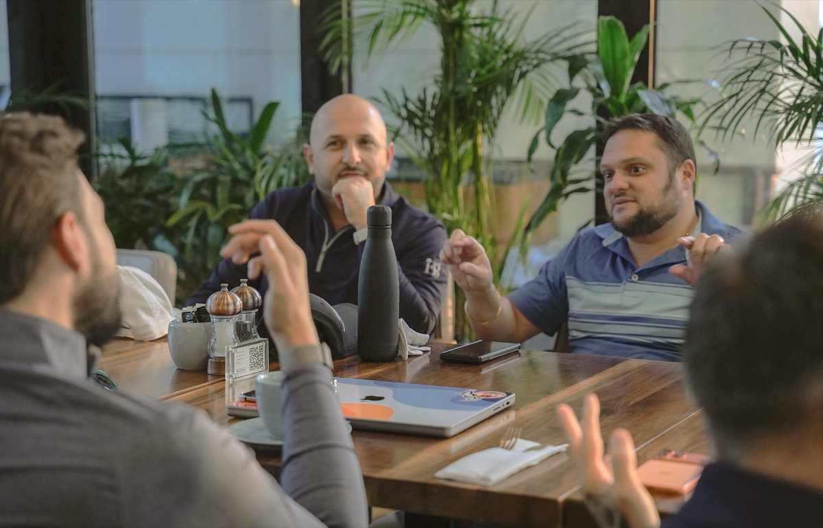 Two members in conversation across a table