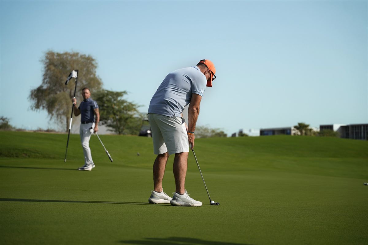 Two members on the putting green